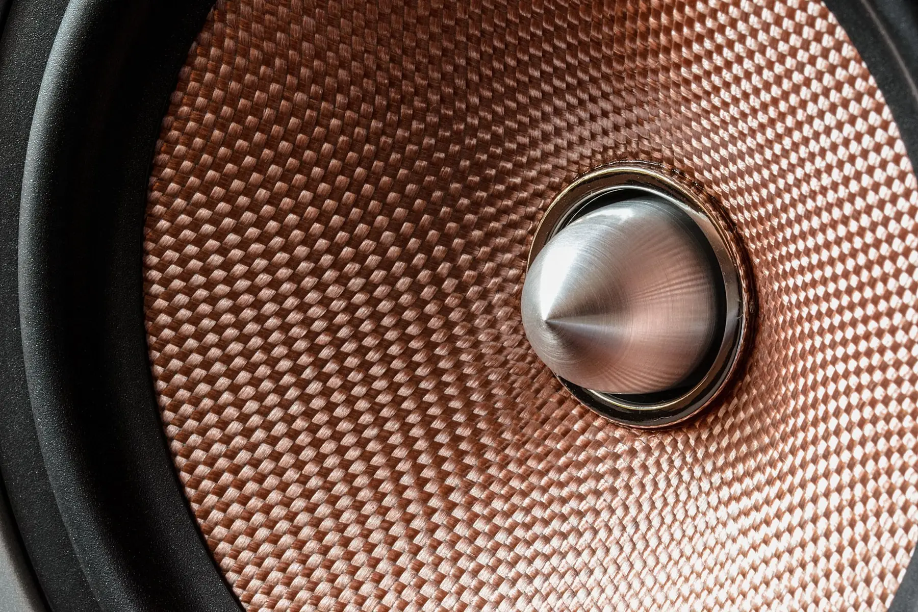 Close-up of a copper speaker cone.